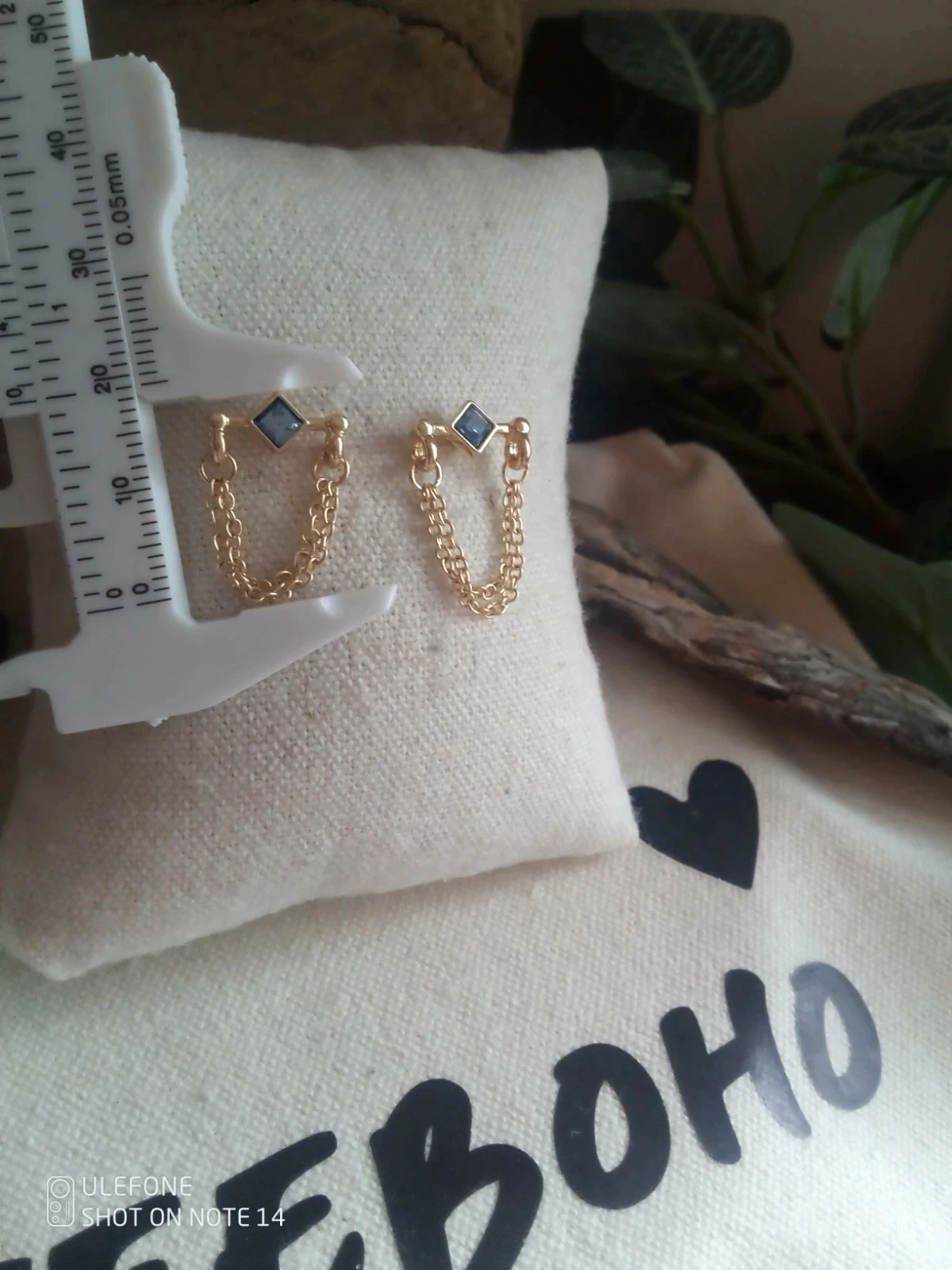 Pendientes dorados con circonitas azules – photo 2